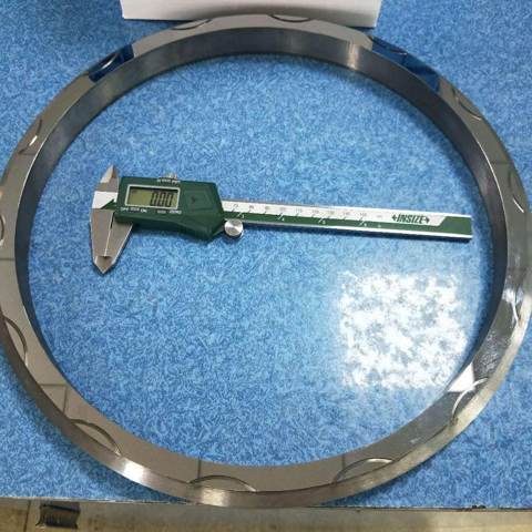 A seal ring pictured with a caliper